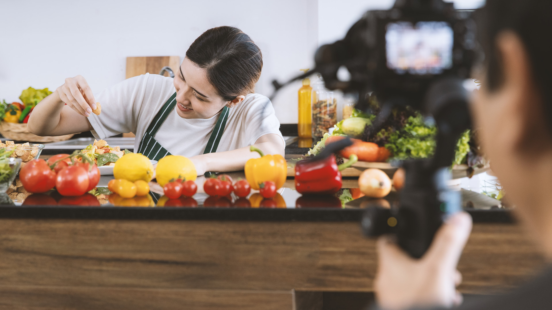 Woman being filmed for a cooking show