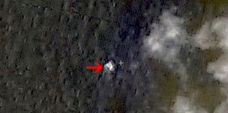 A Chinese satellite imaged three objects floating in the South China Sea on March 9, 2014, but officials now confirm the objects were not parts of Malaysian Airlines Flight 370, which went missing on March 7. Image uploaded March 13, 2014.