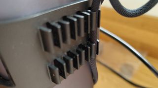 LaserPecker 4 review; a close up of a cable tidy clip on the back of a laser machine