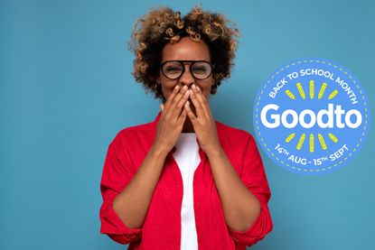 Young African American woman with curly hair laughing and embarrassed giggle covering mouth with hands, gossip and scandal concept