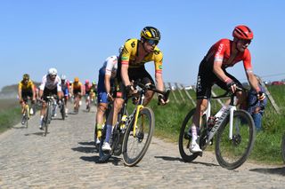 ROUBAIX FRANCE APRIL 17 LR Nathan Van Hooydonck of Belgium and Team Jumbo Visma and Matis Louvel of France and Team Arka Samsic compete passing through a cobblestones sector during the 119th ParisRoubaix 2022 Mens Elite a 2572km one day race from Compigne to Roubaix ParisRoubaix WorldTour on April 17 2022 in Roubaix France Photo by Luc ClaessenGetty Images