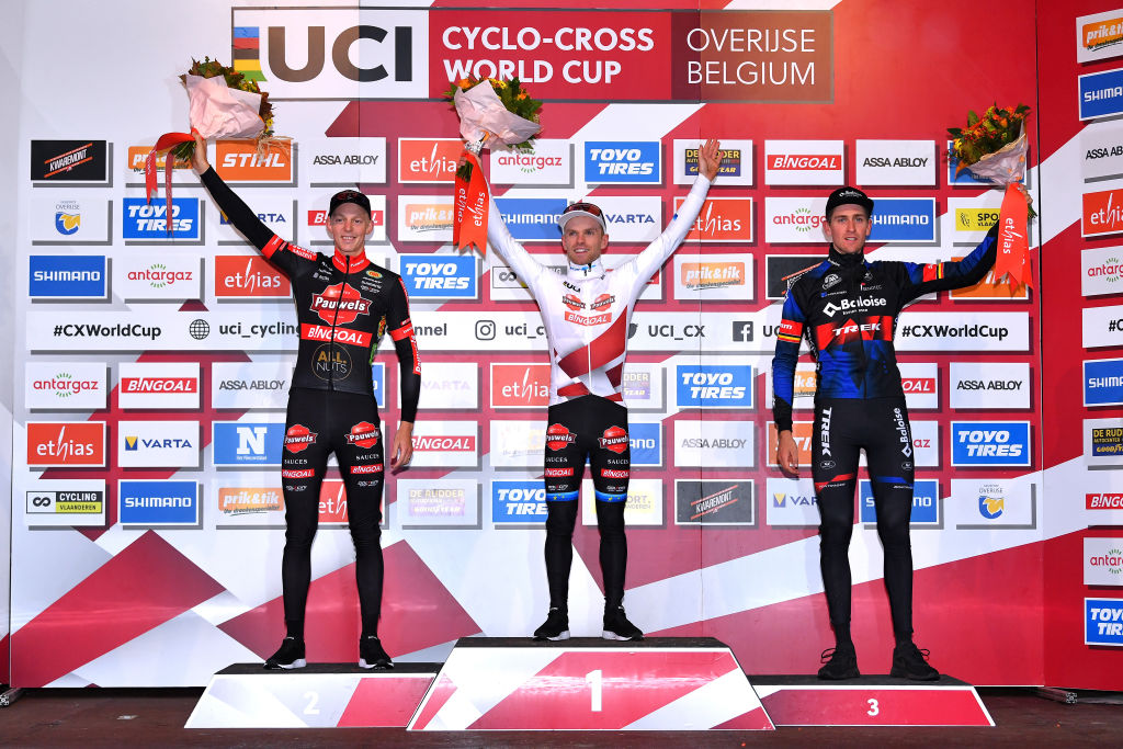 OVERIJSE BELGIUM OCTOBER 31 LR Michael Vanthourenhout of and Team Belgium Pauwels Sauzen Bingoal on second place race winner Eli Iserbyt of Belgium and Team Pauwels Sauzen Bingoal and Toon Aerts of Belgium and Team Baloise Trek Lions on third place pose on the podium ceremony after the 62nd Druivencross Overijse UCI CycloCross Worldcup 2021 Mens Elite DruivencrossOverijse CXWorldCup UCIcyclocrossWC on October 31 2021 in Overijse Belgium Photo by Luc ClaessenGetty Images