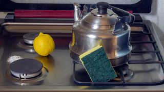 how to descale your kettle using natural materials demonstrated with an image of a kettle, soda water and lemon
