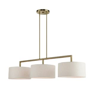 A brushed gold linear kitchen pendant light with three white curved lampshades hanging off it