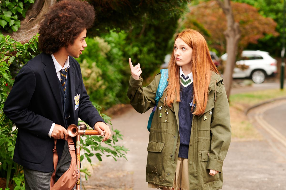 Harriet points at Toby as he ride his scooter in Geek Girl episode 1