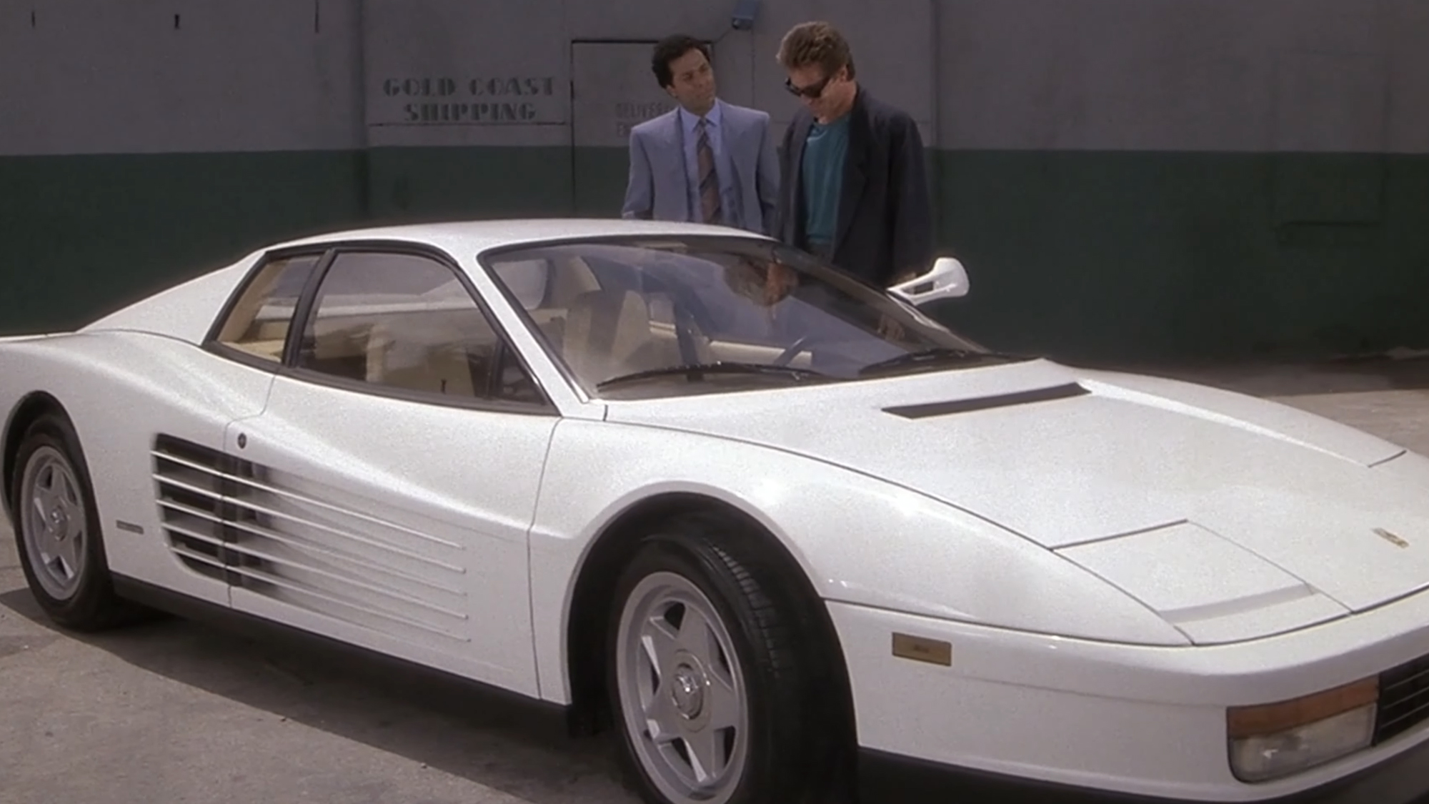 Miami Vice stars Don Johnson as James &amp;quot;Sonny&amp;quot; Crockett and Philip Michael Thomas as Ricardo &amp;quot;Rico&amp;quot; Tubbs, stand by the most 1980s car you've ever seen.