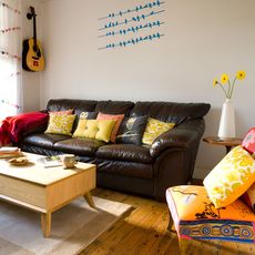 living room with wooden floor and lather sofa