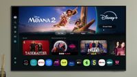 The Samsung S90F TV mounted on a wall with Moana 2 on Disney+ featured prominently on the menu screen.