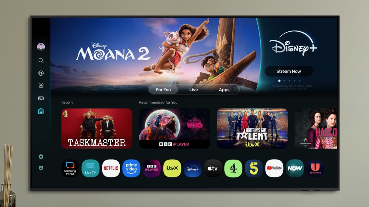 The Samsung S90F TV mounted on a wall with Moana 2 on Disney+ featured prominently on the menu screen.