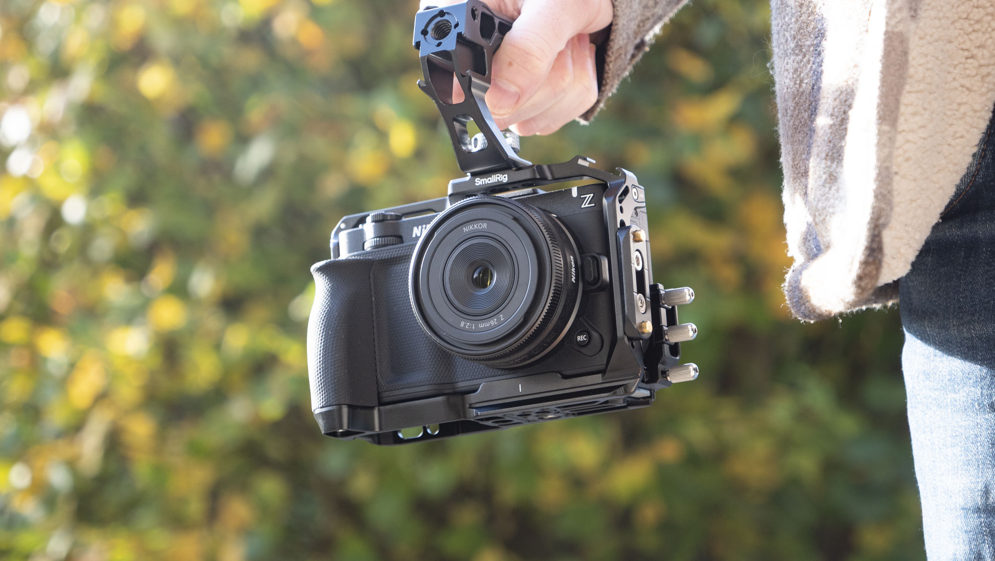 Nikon ZR product photos – inside a dedicated SmallRig cage, held by user