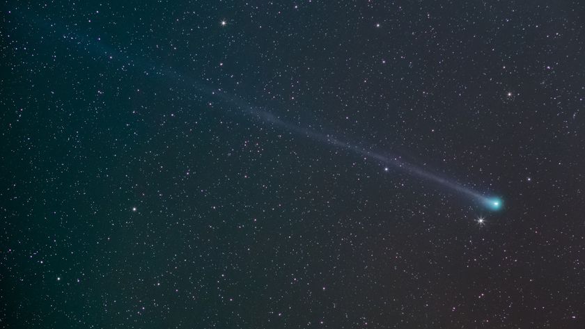 A photo of a comet in the starry night sky