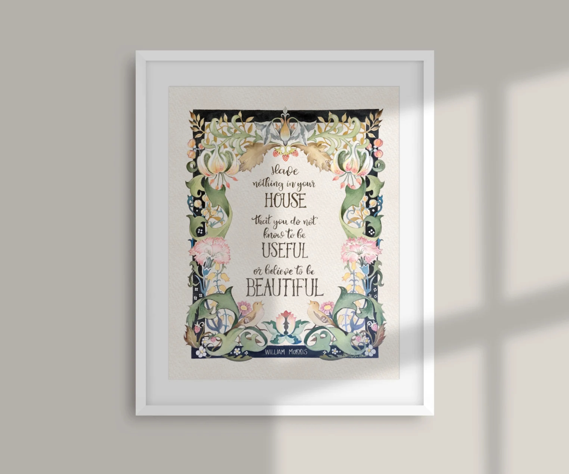 print of William Morris quote in white frame with floral design around words