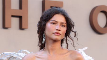 Zendaya posing at the Odyssey premiere.