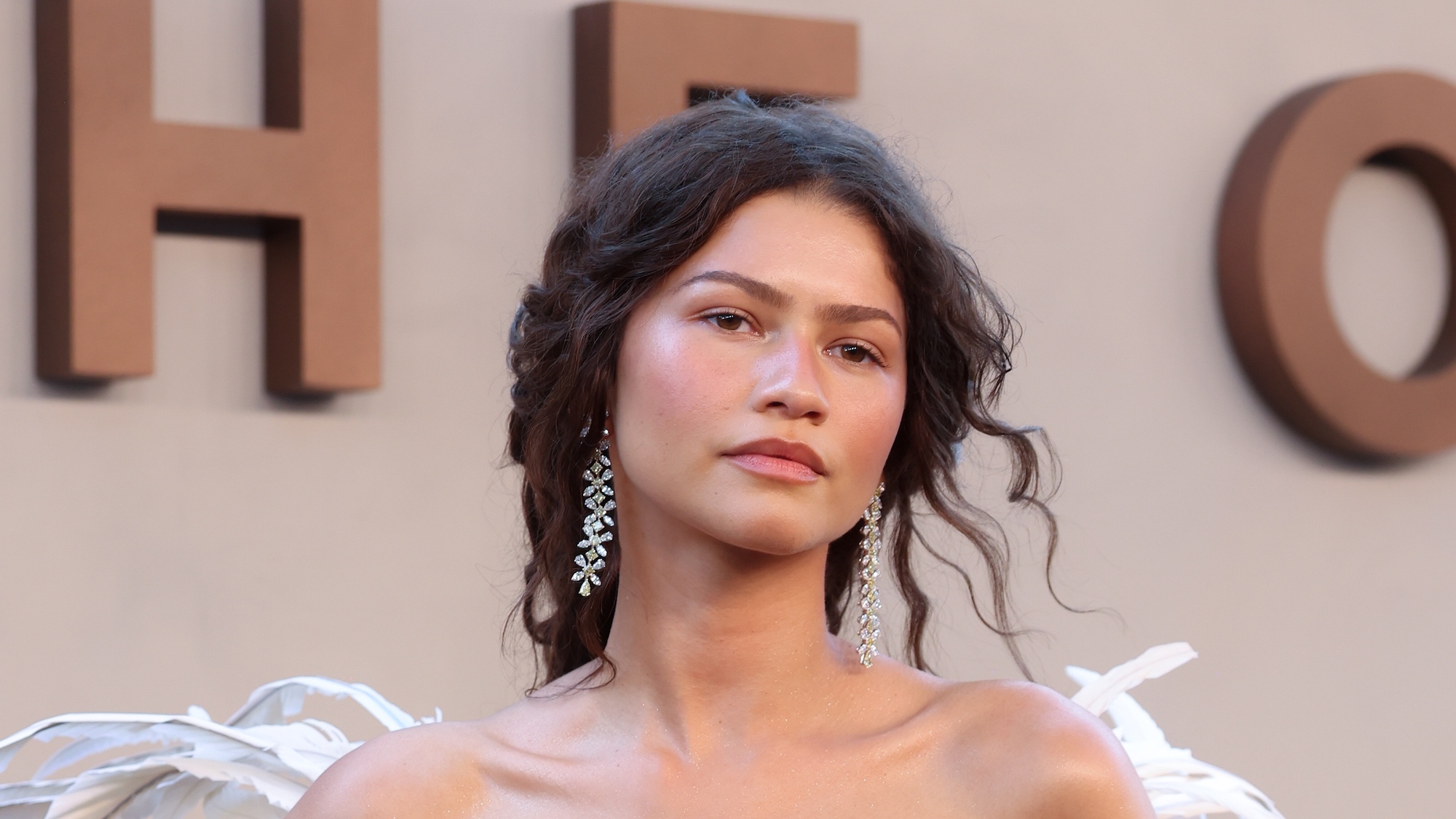 Zendaya posing at the Odyssey premiere.