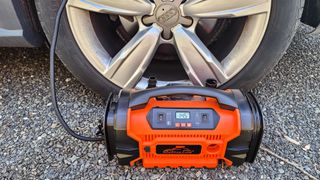 Roofpax Air Compressor inflating car tire