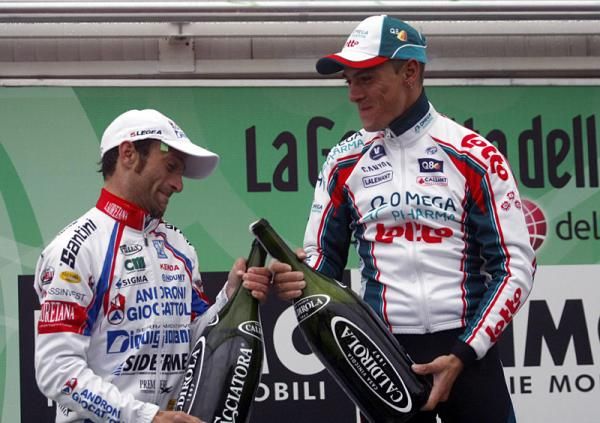 Michele Scarponi and Philippe Gilbert look a bit mischievous on the podium.