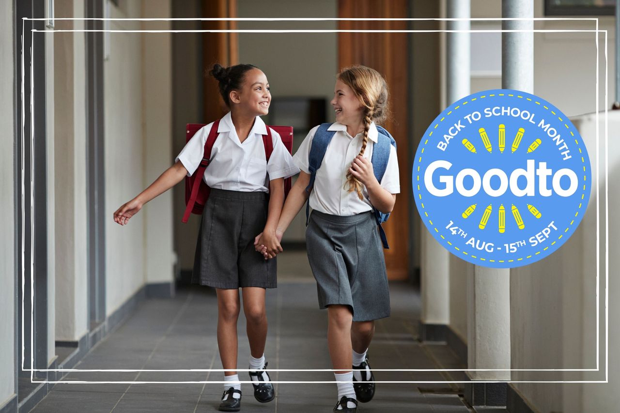 Schoolgirls running hand in hand in school and laughing