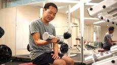 Man doing bicep curl in the gym