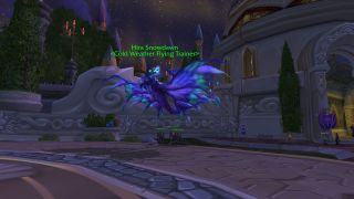 Wrath Classic flying - an NPC sits on a brightly coloured flying mount in the city of Dalaran