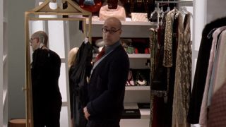 Nigel with a dress for Andy in The Devil Wears Prada