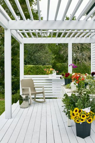 Aamir Khandwala project with white painted wood beams covering a verandah