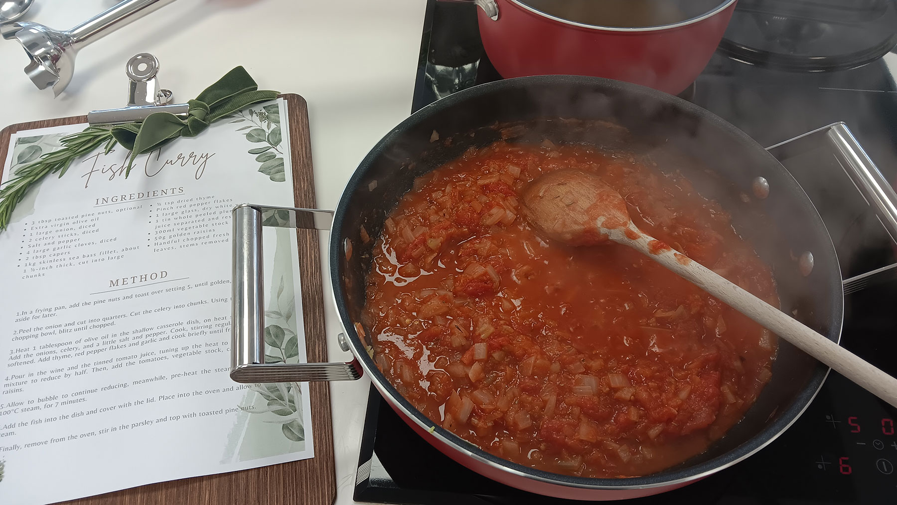 Sauce simmering on a SMEG induction cooktop