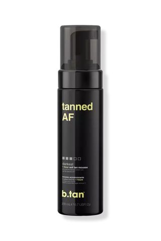 A bottle of b. Tan Tanned AF 1 Hour Self Tan Mousse against a white background.