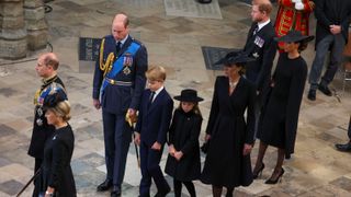 Prince William, Prince of Wales, Catherine, Princess of Wales, Prince Harry, Duke of Sussex, Meghan, Duchess of Sussex, Prince George of Wales and Princess Charlotte of Wales at Westminster Abbey after the State Funeral of Queen Elizabeth II on September 19, 2022 in London, England.