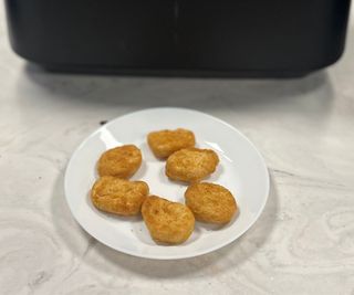 Close-up of nuggets cooked in the Ninja Foodi FlexBasket Air Fryer.