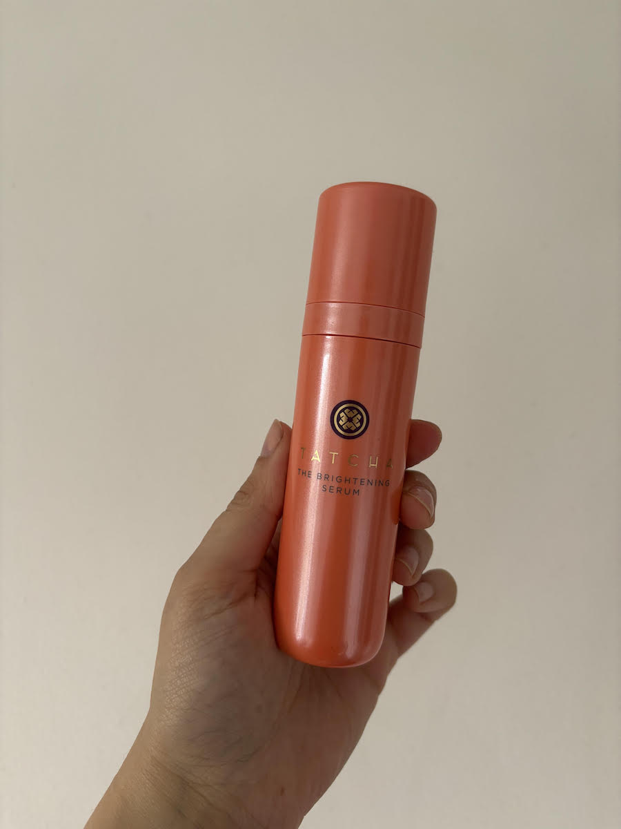 Mica holding Tatcha The Brightening Serum - best vitamin C serums