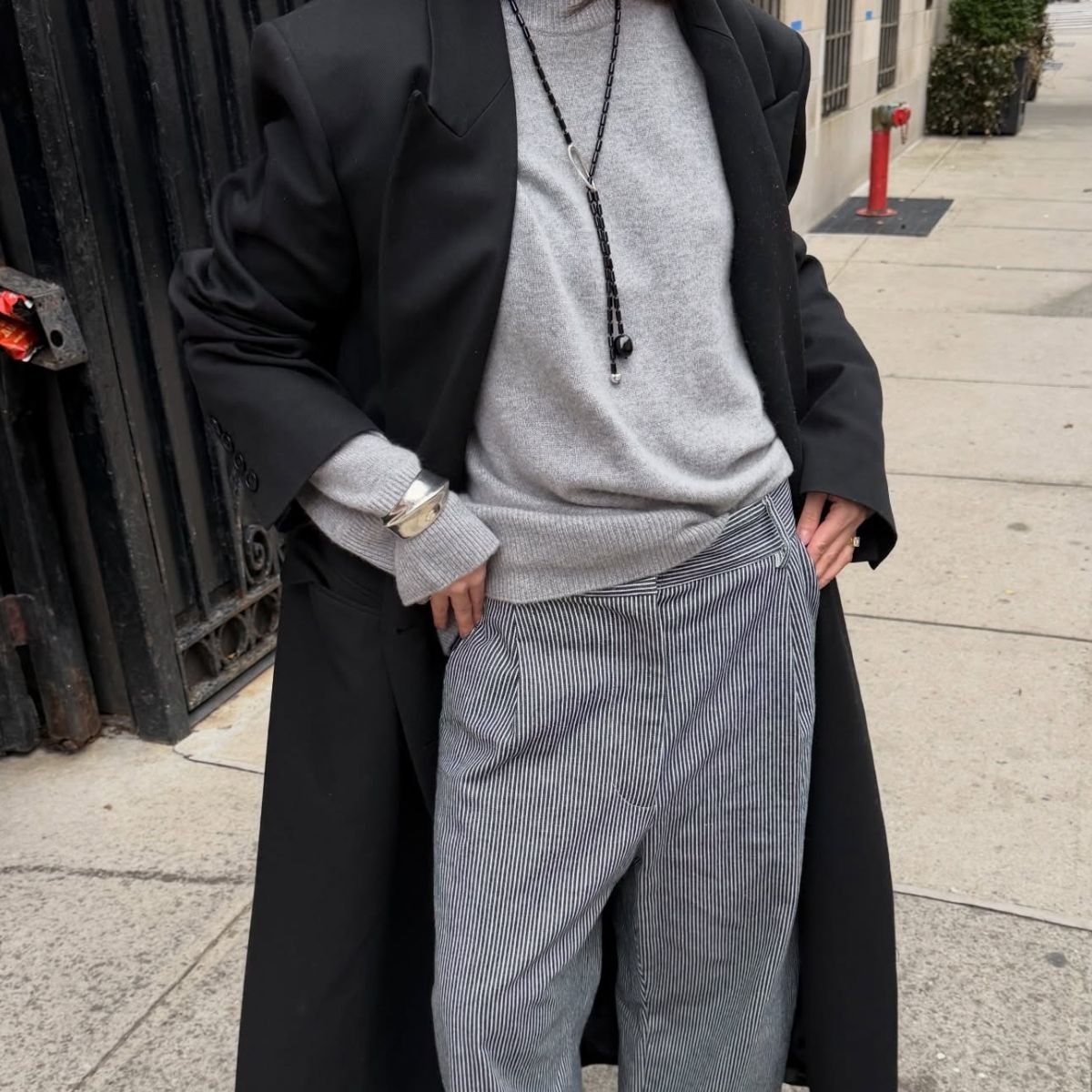 Creator @mimixn wearing a grey and black autumnal outfit