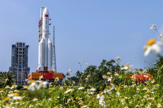 A Chinese Long March 5B rocket carrying the Tianhe space station core module rolls out to its launchpad at the Enchang Spacecraft Launch Site on Hainan Island in the southern Hainan province on April 23, 2021 ahead of a planned April 29 launch.