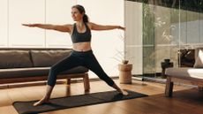 Woman doing yoga to loosen tight hips on mat in studio
