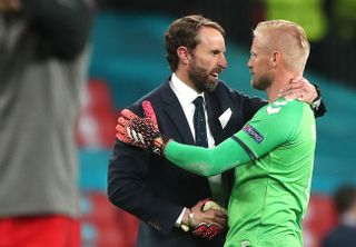 England manager Gareth Southgate consoles Denmark goalkeeper Kasper Schmeichel after the final whistle