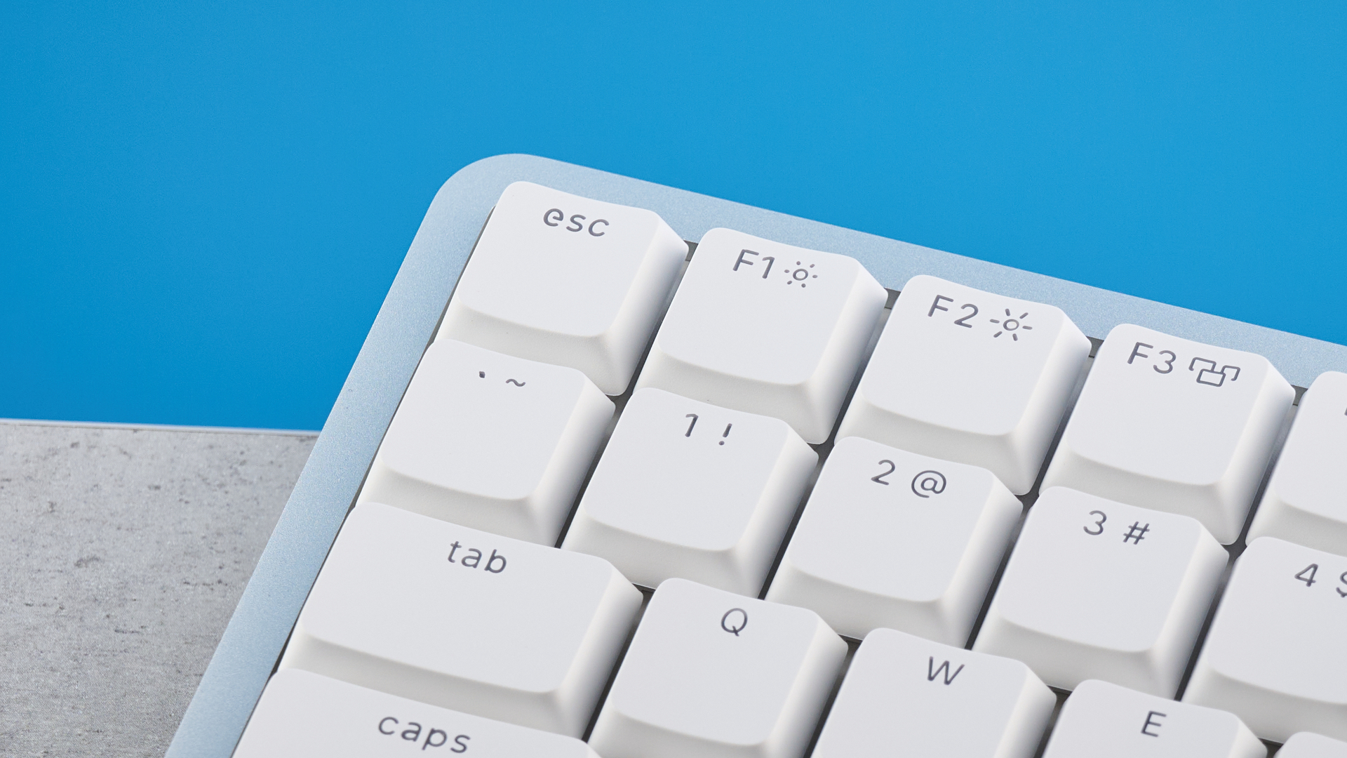 The Lofree Flow 2 on a stone surface with a blue background