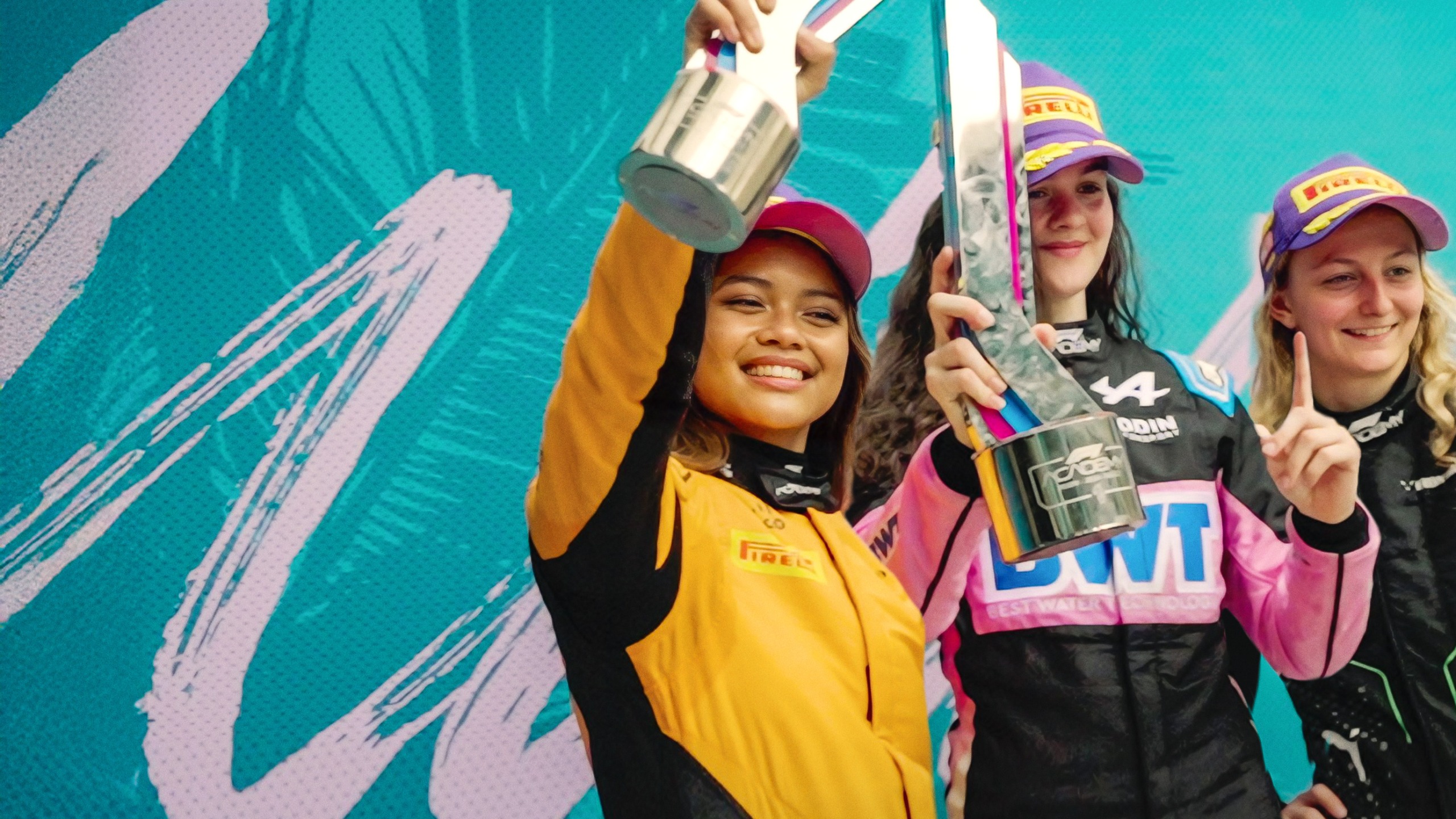 F1: The Academy. (L to R) Bianca Bustamante, Abbi Pulling, and Doriane Pin in F1: The Academy 