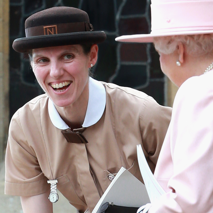 Prince George's nanny, Maria Teresa Turrion Borrallo (in her Norland Nanny Uniform) talks to Queen Elizabeth II as they leave the Church of St Mary Magdalene on the Sandringham Estate for the Christening of Princess Charlotte of Cambridge on July 5, 2015 in King's Lynn, England.