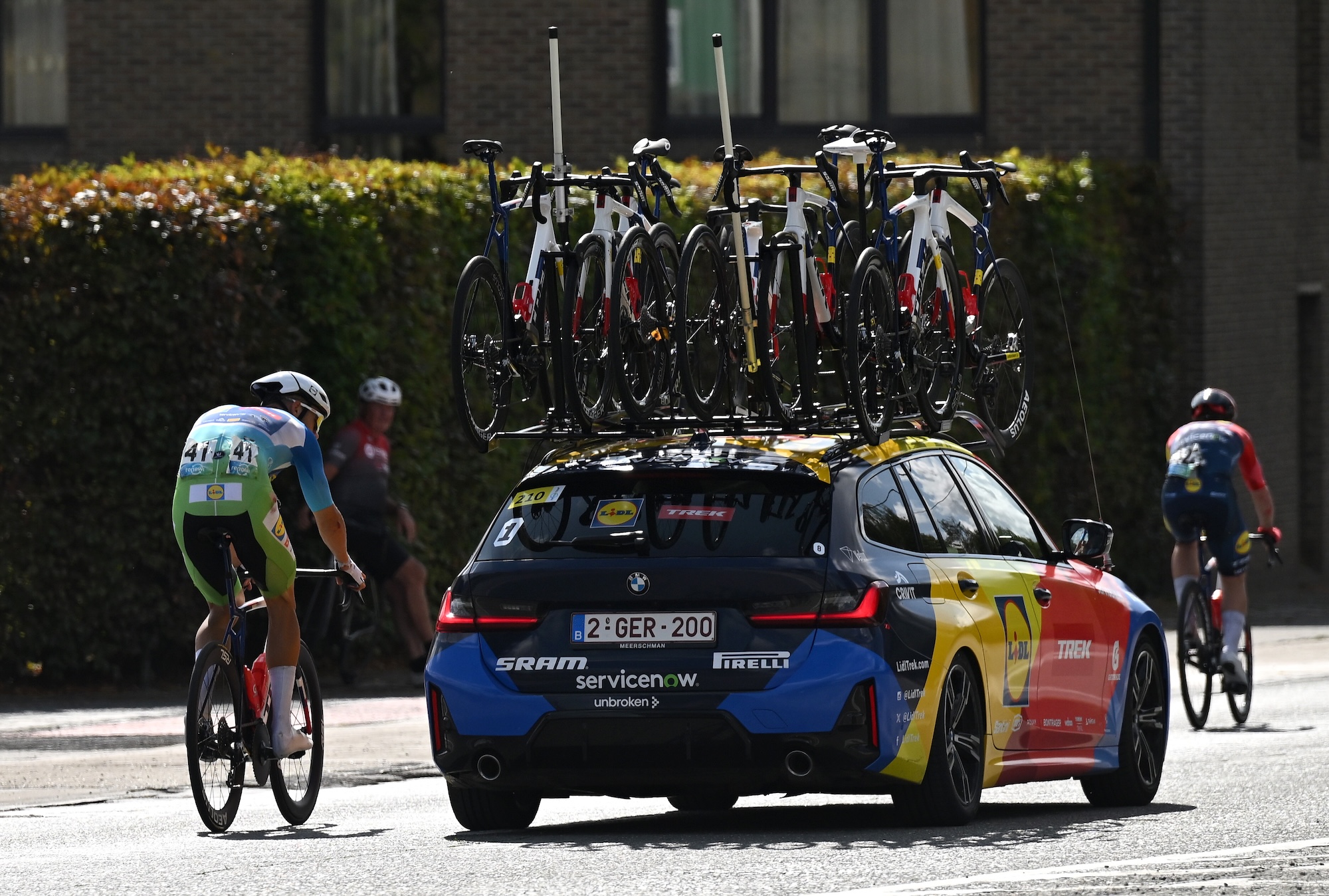 Jonathan Milan ordered to pull over as race leader is lapped by peloton following huge crash at Renewi Tour