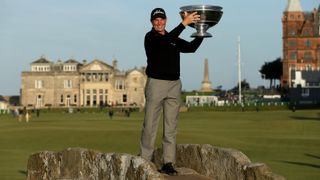 David Howell holds up the Alfred Dunhill Links Championship trophy on the Swilken Bridge in 2013