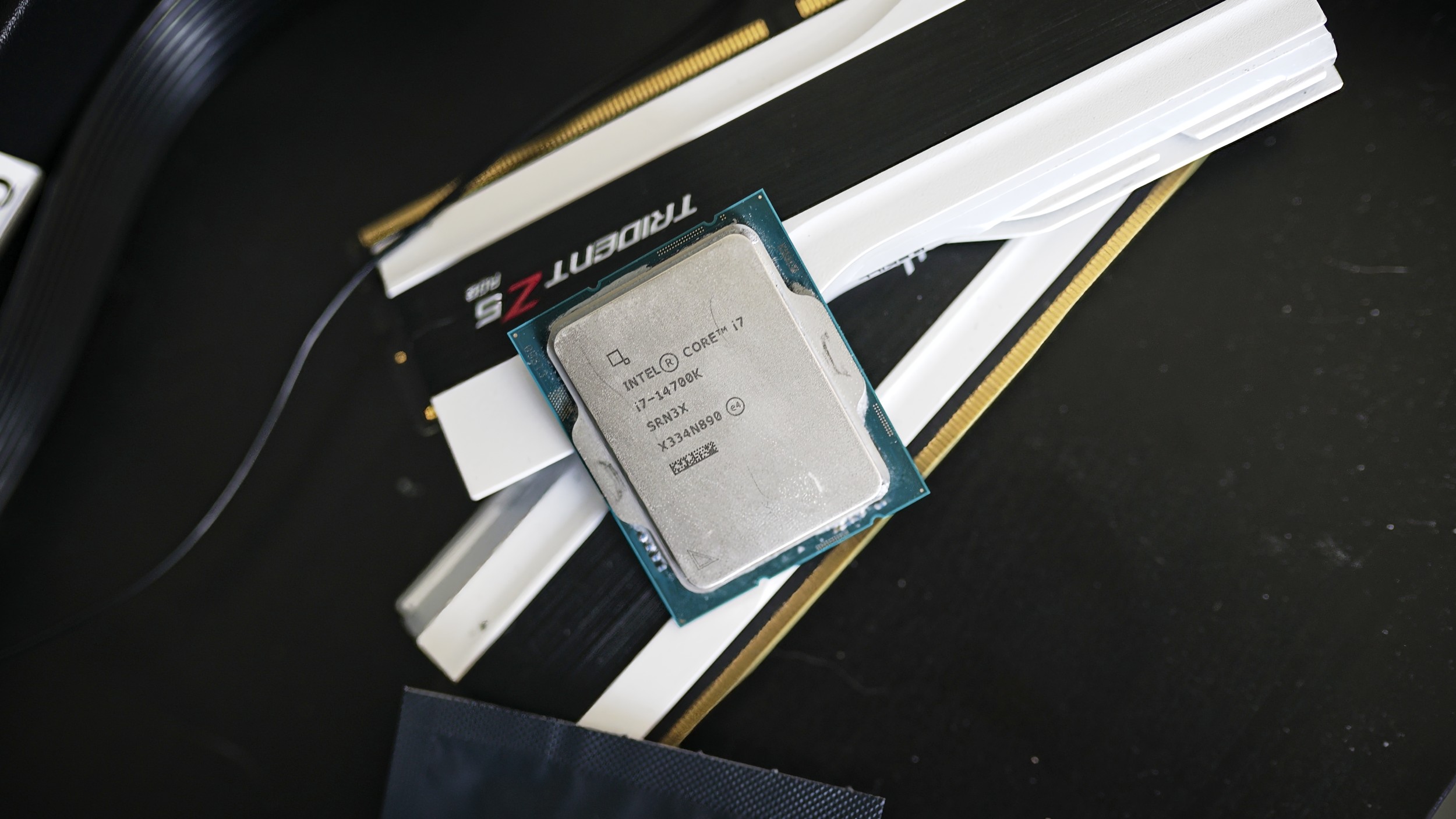 The Intel Core i7-14700K sitting on a table.