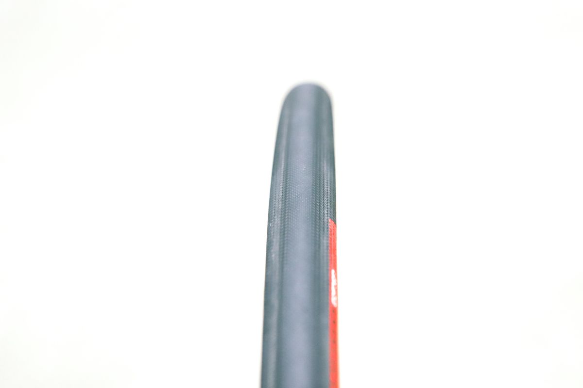 A tan bicycle tyre on a white background