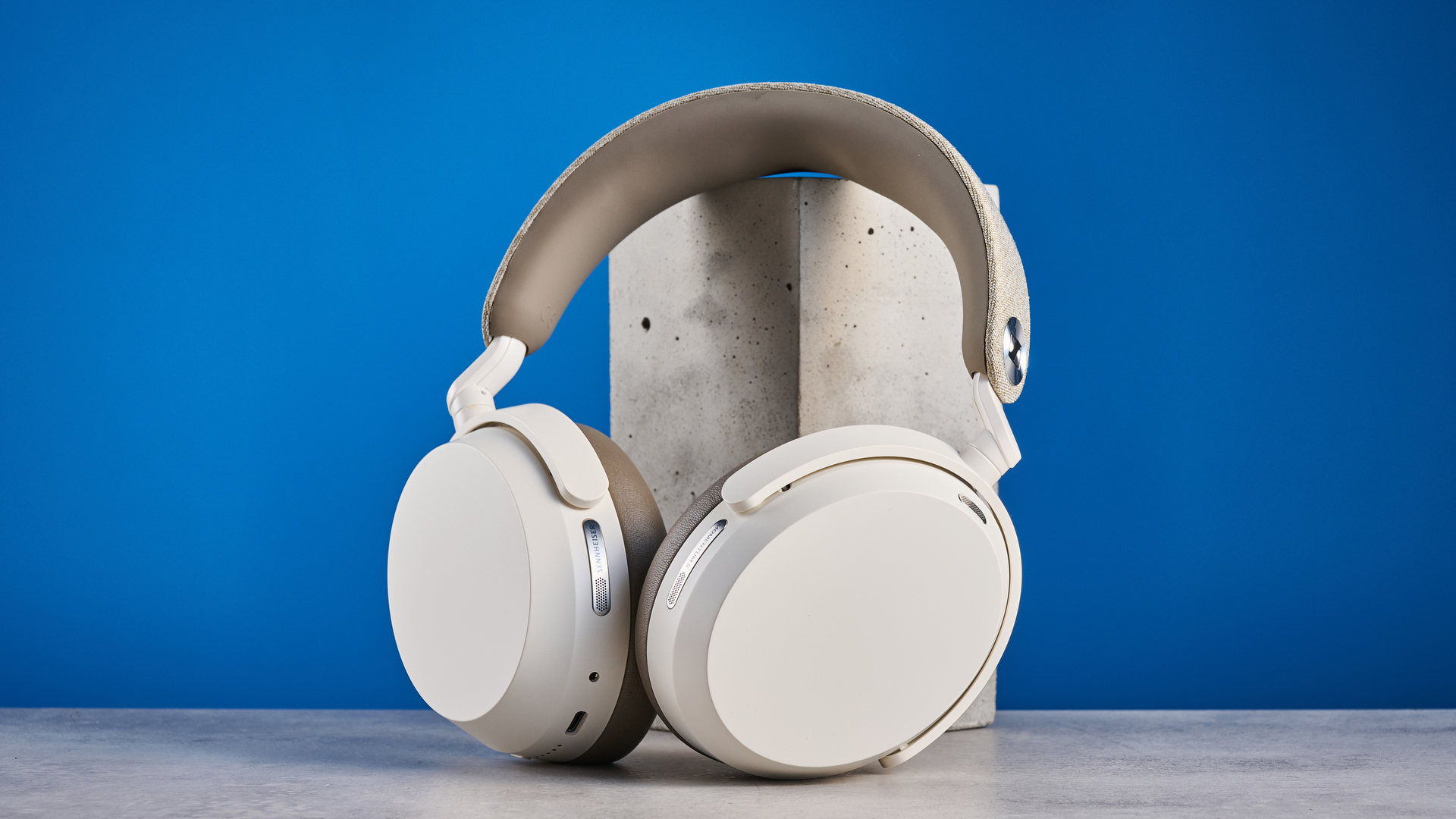 the sennheiser momentum 5 in white photographed against the blue tom's guide background