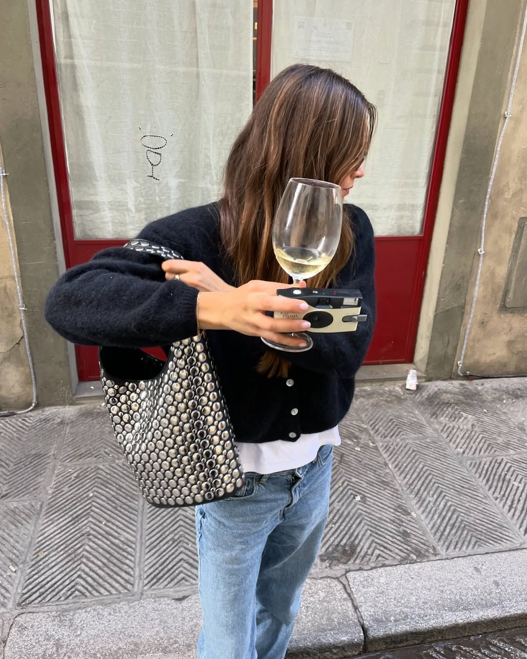 a Dotthz studded handbag