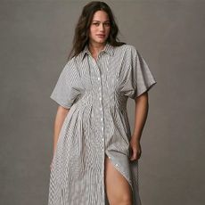 model wears tobie dress from anthropologie and white socks with black loafers