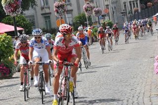 The peloton goes through the lovely town of Stavelot.