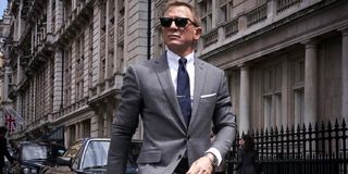 No Time To Die Daniel Craig sharply dressed on a walk