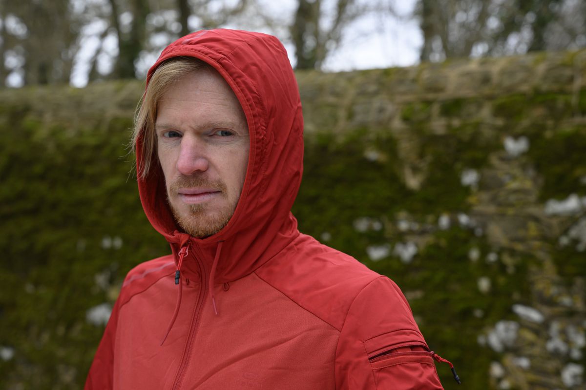 A man in a red hoodie