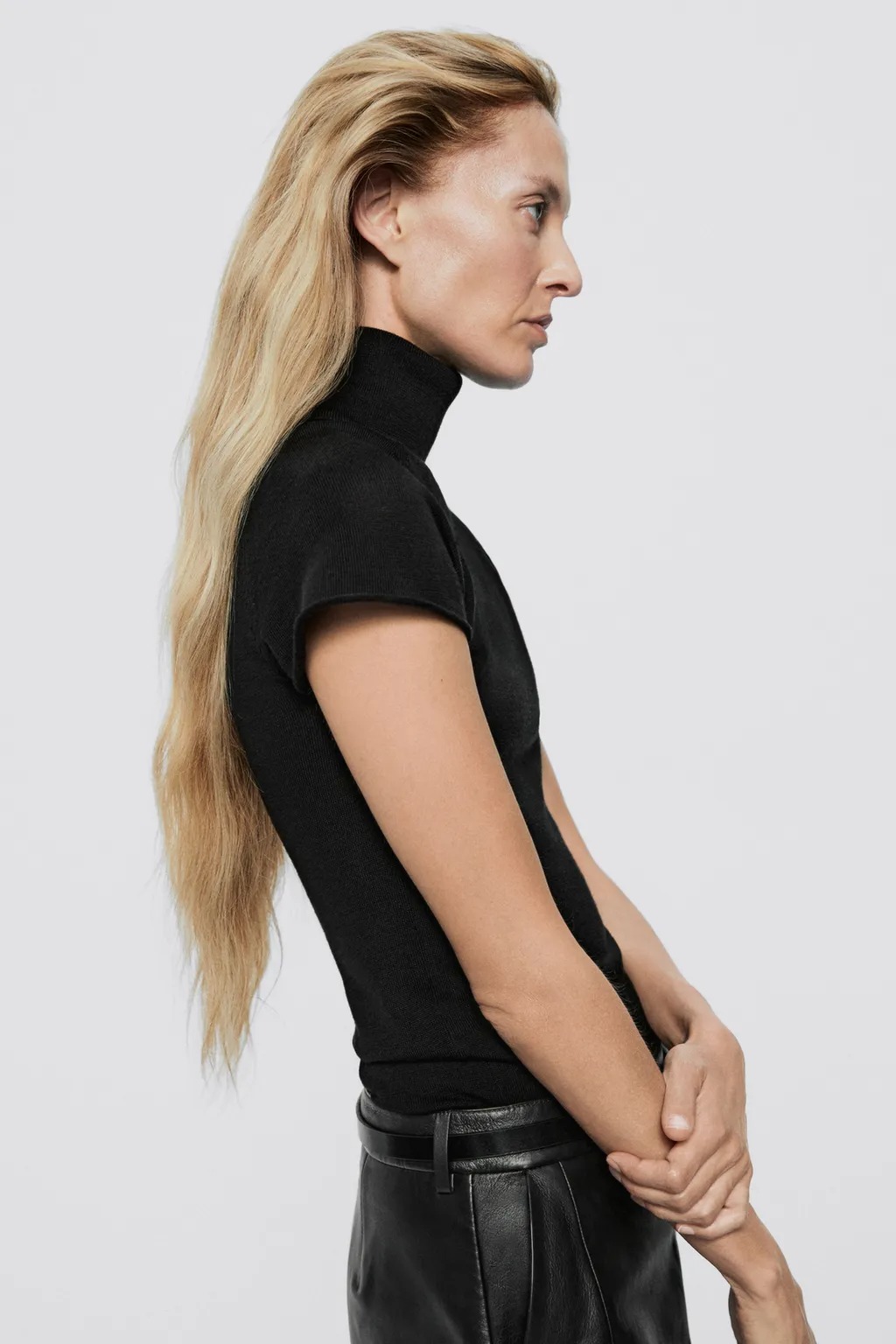 Massimo Dutti model wearing a black sleek turtleneck