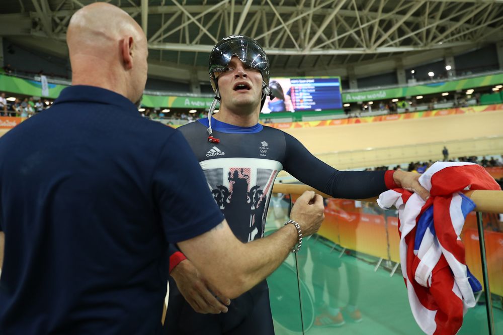 Callum Skinner of Great Britain celebrates after winning gold and getting an Olympic record in the Men's Team Sprint Track