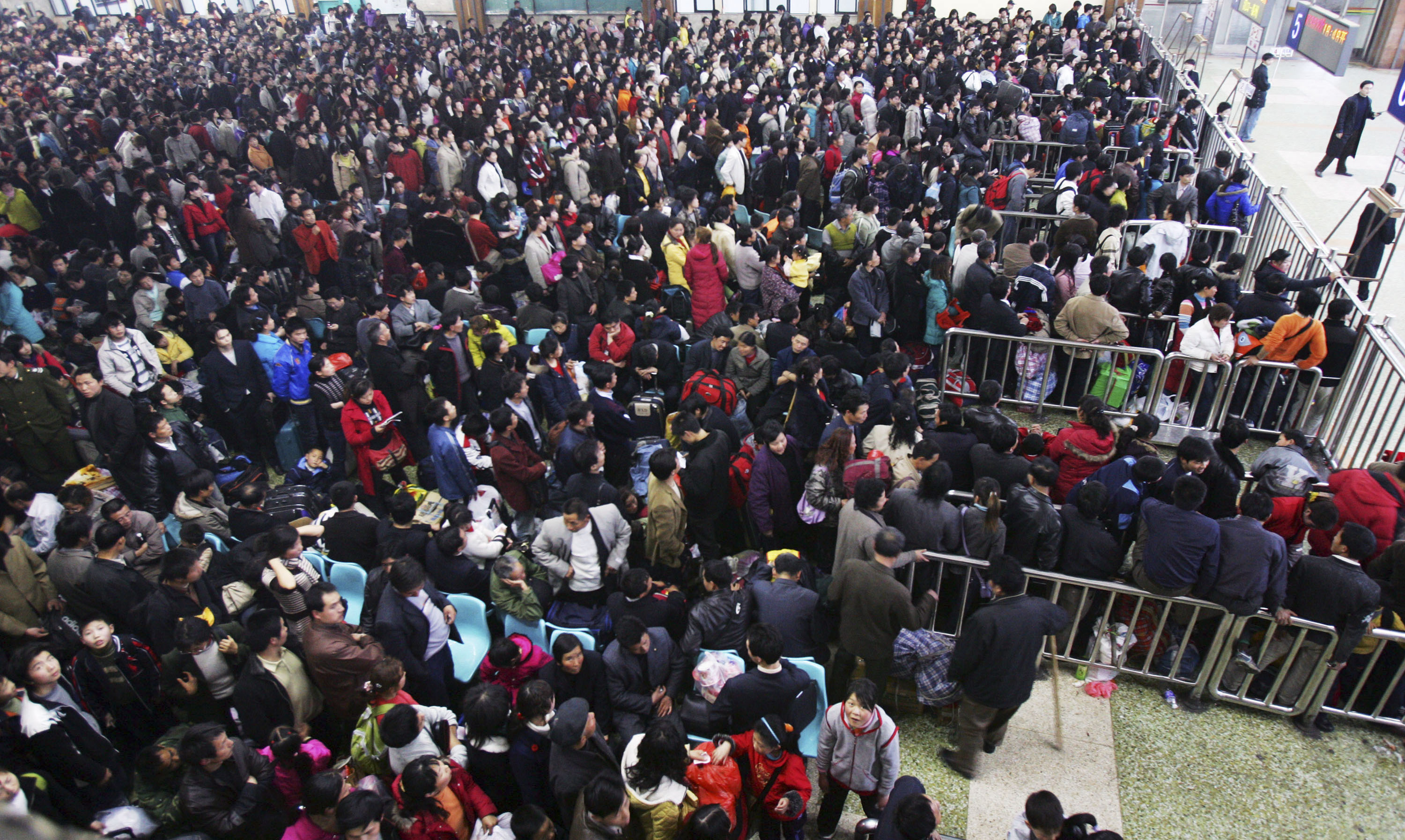 A large number of people gather during the day. This is an aerial shot.